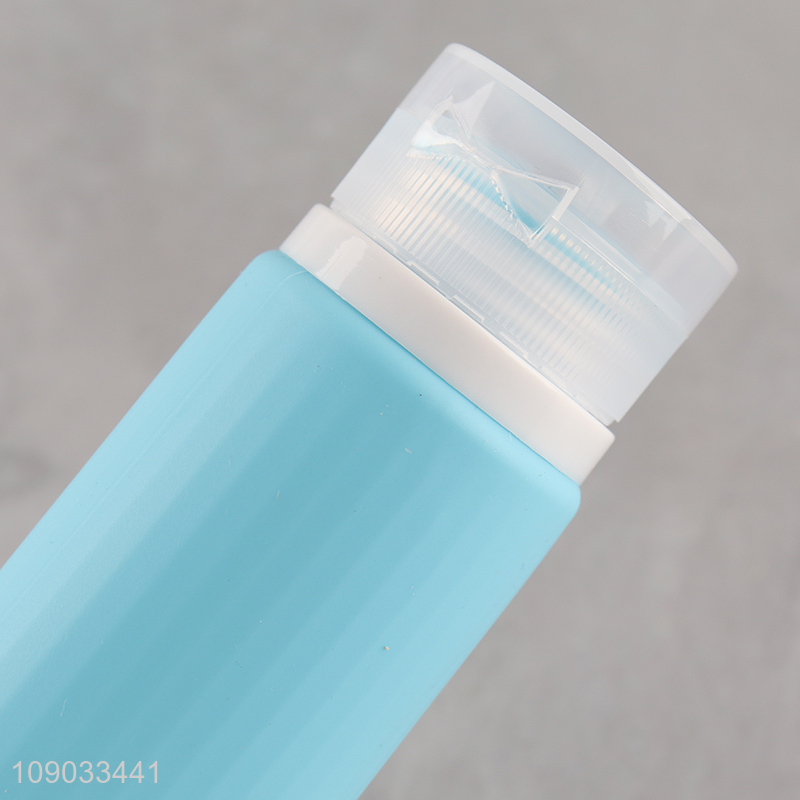 High quality portable travel silicone squeeze bottle with facial cleaning brush