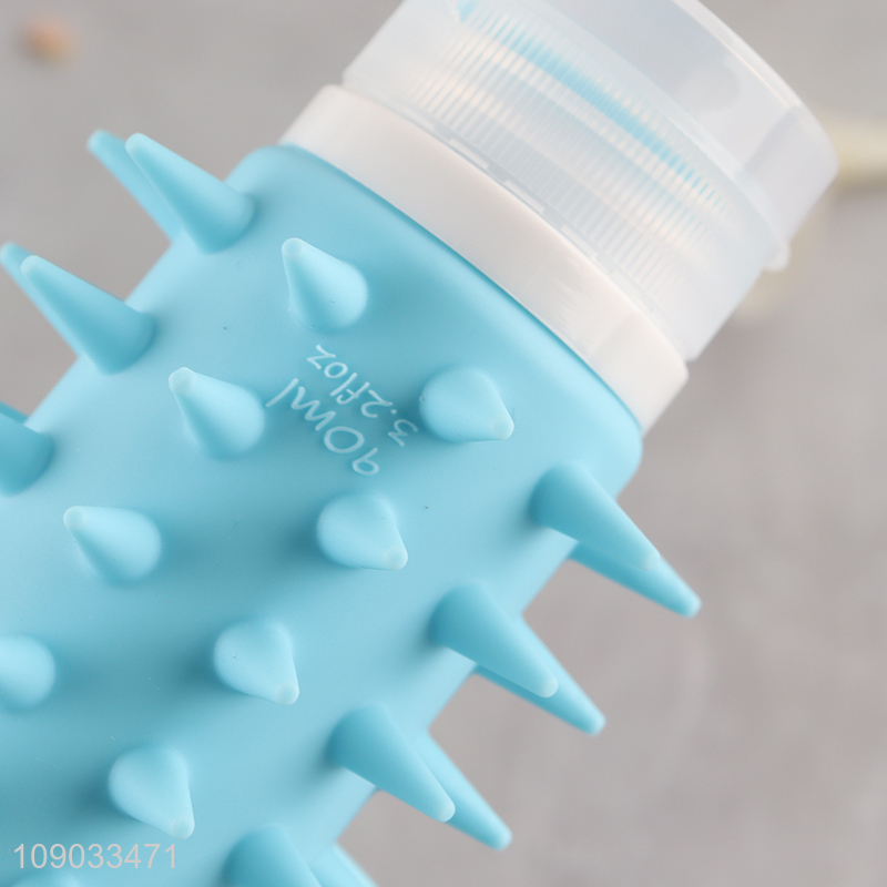Yiwu market portable travel silicone squeeze bottle shampoo bottle with brush