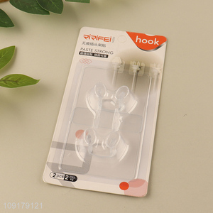 Top selling 2pcs household paste strong plug holder sticker wholesale