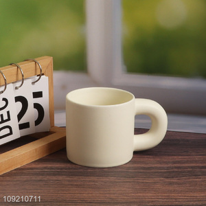 Yiwu market white ceramic 320ml water cup coffee cup with handle