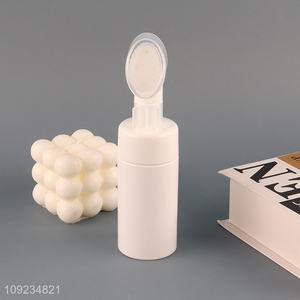 Low price plastic skin care face washing bottle with facial cleansing brush