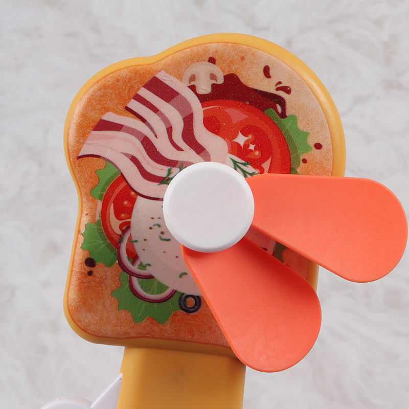 Factory price portable travel cartoon handheld fan for sale